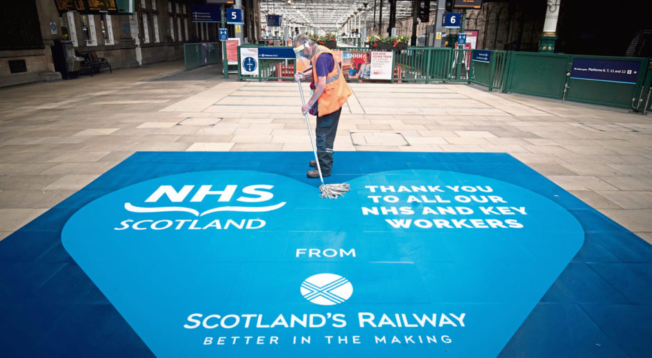 Members of the cleaning team at work in Waverley Station, Edinburgh.