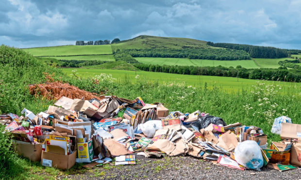 Fly tipping on the outskirts of Auchterhouse from what appear to be a store or local shop.