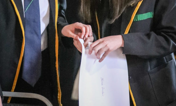 Pupils receiving exam results.