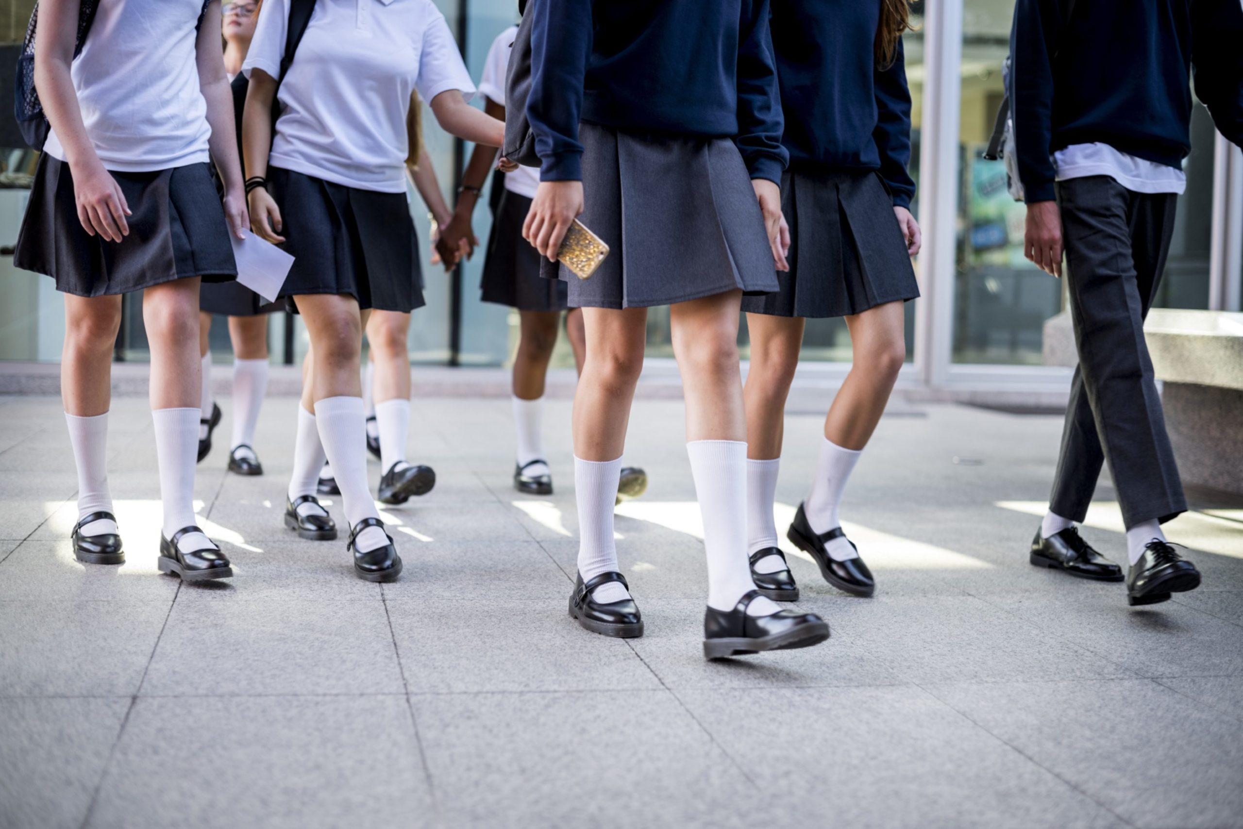 Group of students walking at school.