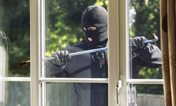 Men wearing balaclavas seen in care home grounds (image posed by model)