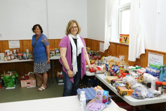 Benholm and Johnshaven community council chairwoman Mairi Eddie (right) and volunteer Kathryn Rojas, at the community larder.