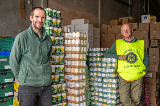 Michael Calder (left) Dundee Foodbank warehouse manager and Nick White, Claverhouse Rotarian and Dundee Foodbank volunteer.