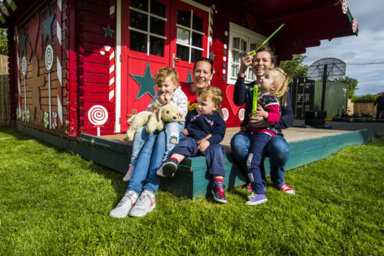 Pauline and Claire and their triplets.