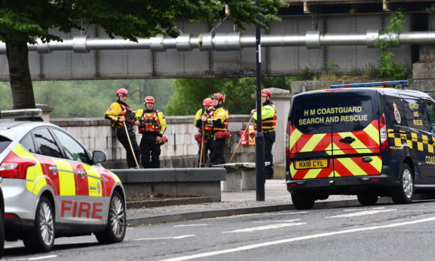 Rescuers flocked to Tay Street on Sunday morning.