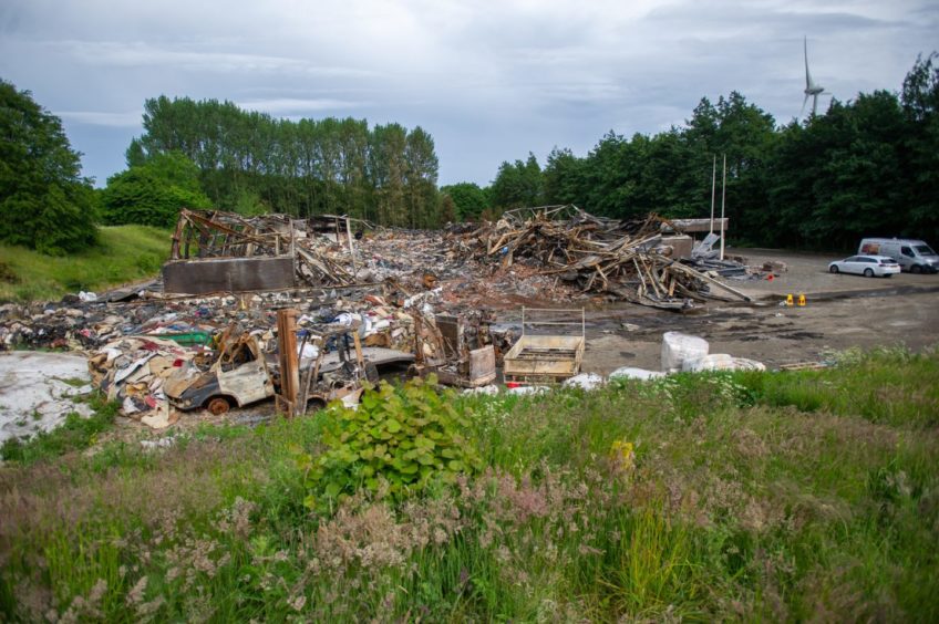 The remains of the building that was destroyed by a fire at Baldovie Industrial Estate.