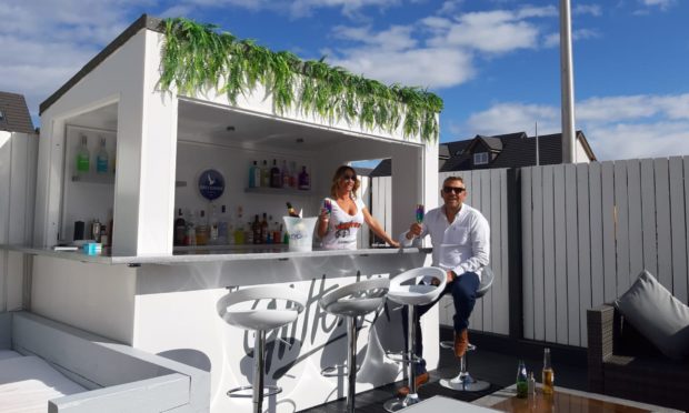 Mike and Laura at their Ibiza-style bar.