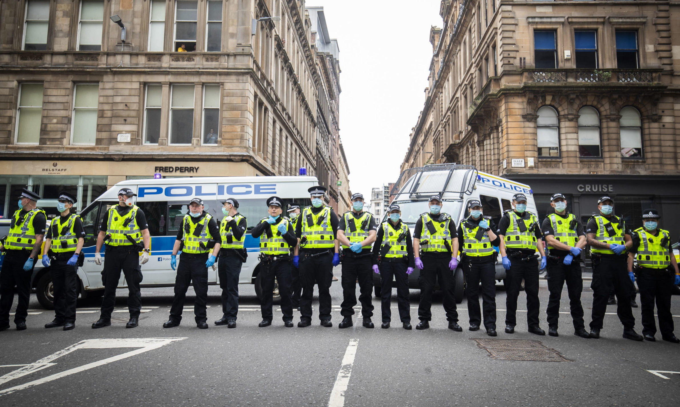 Police hold back protesters at a demonstration organised by the Loyalist Defence League in George Square in Glasgow.