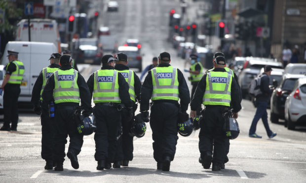 Police in George Square in Glasgow during a previous protest.