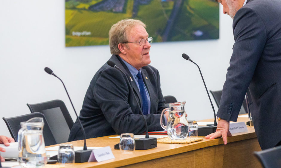 Councillor Ian James at his desk in the Perth and Kinross council chambers