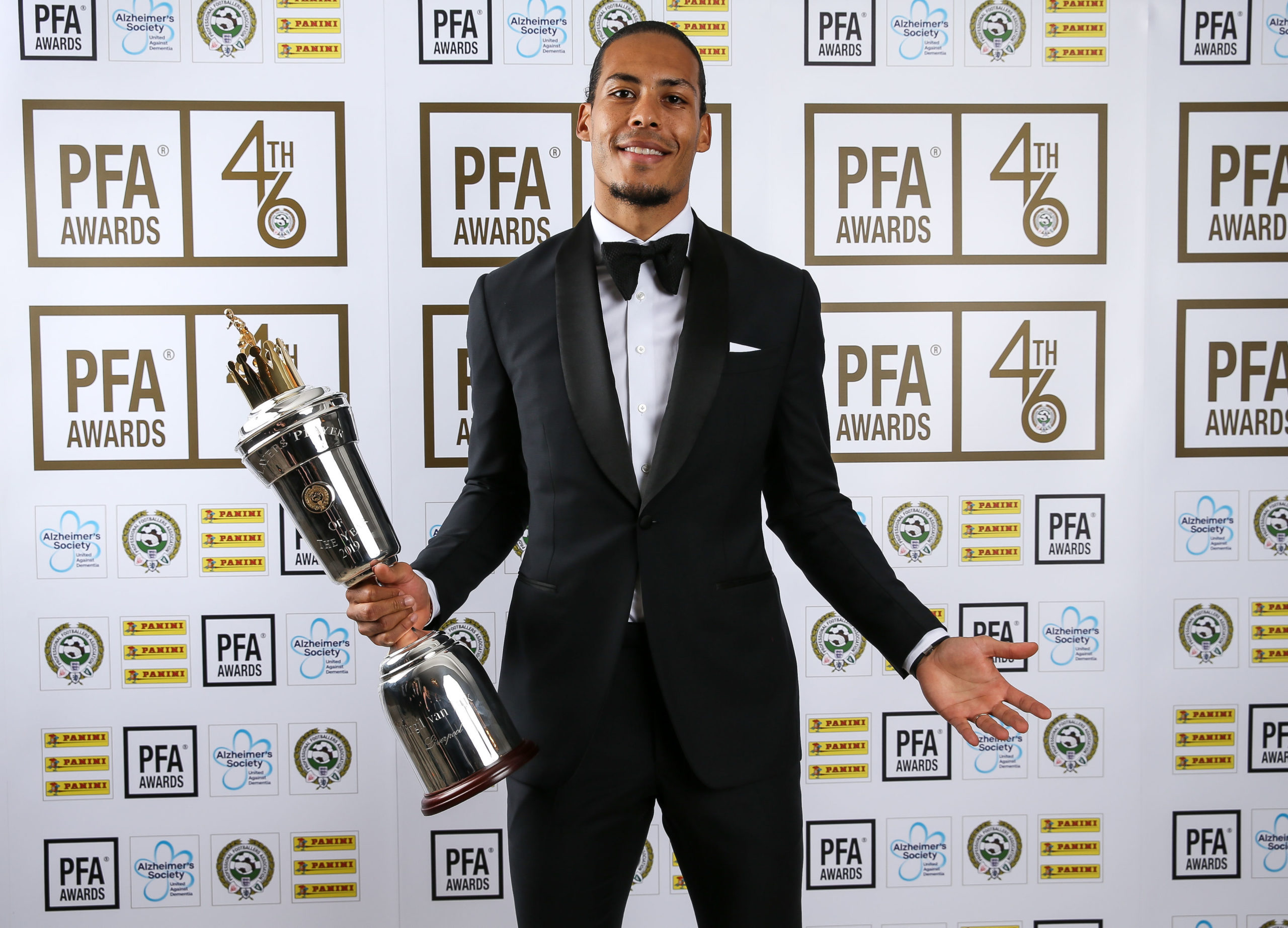 Liverpool's Virgil van Dijk poses with his PFA Player of the Year award last May