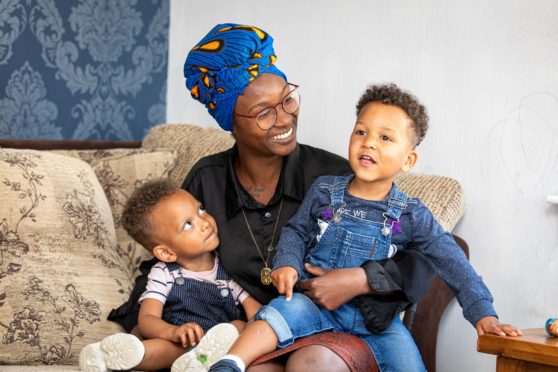 Mercy Kessy with her twin sons Lucas and Tobias.