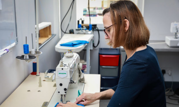 Mirka at work in her shop.