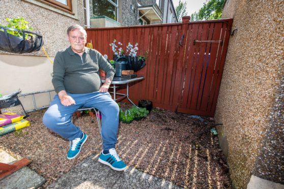 Mr Madden at his home where his scooter was stolen.