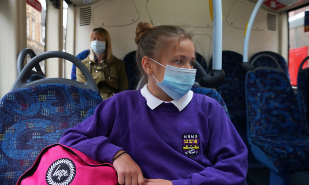 A pupil heading to school in England