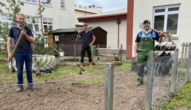 Forfar JAC members Jamie Houston, Andrew Beattie and Bruce Keillor get stuck in at Webster's High School in Kirriemuir.