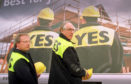 Donald Dewar and Henry Mcleish in front of Yes to Devolution billboards in Glasgow 1997.