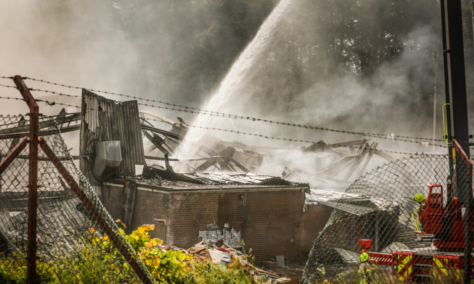 The smoking remains of the fire-hit building at Baldovie Industrial Estate.