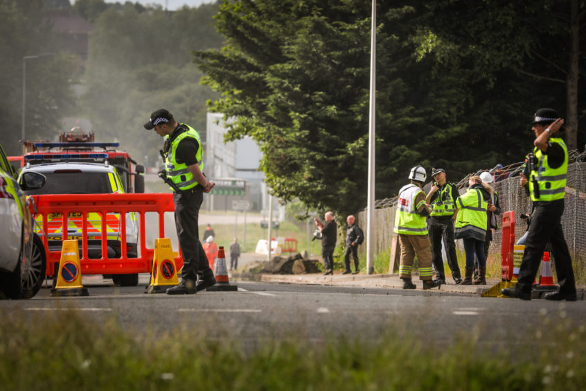 Police at the scene at Baldovie as the fire was dealt ith