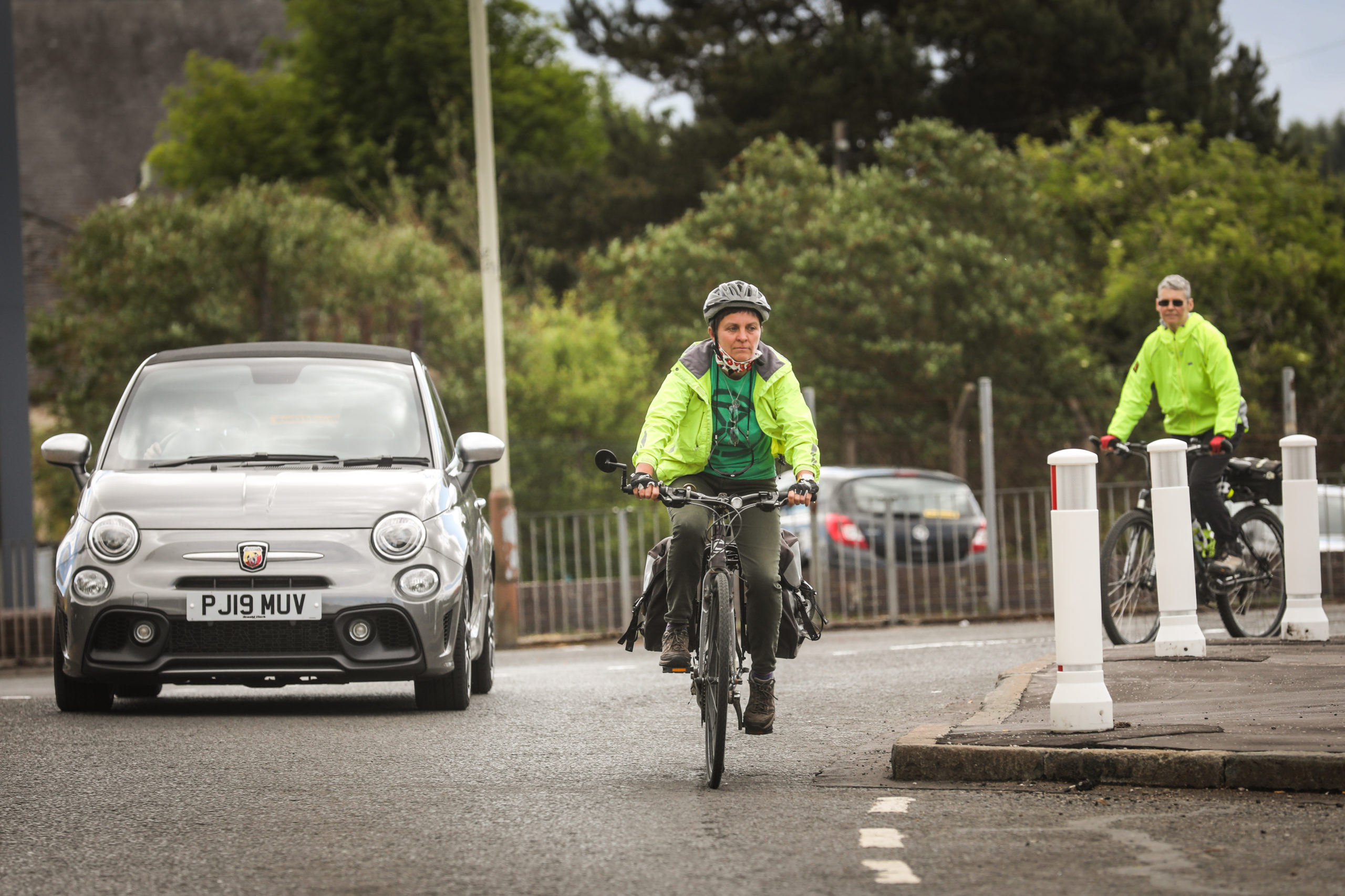 Local woman Kate Treharne cycling on Harefield Road next to an extended kerb.