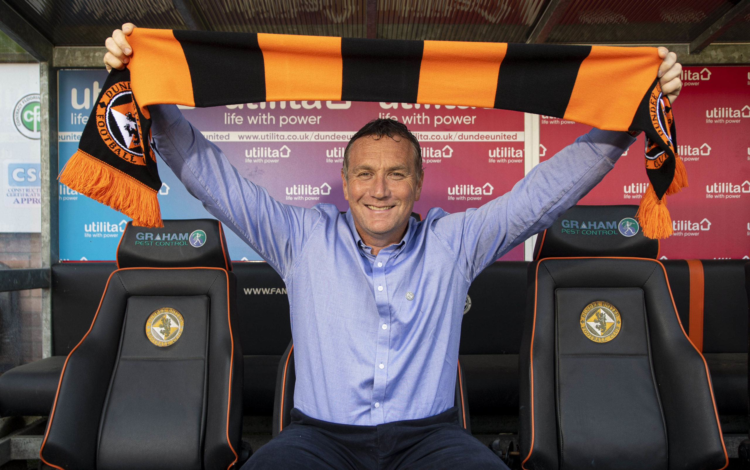United's new boss Micky Mellon gets comfy in the Tannadice dugout.