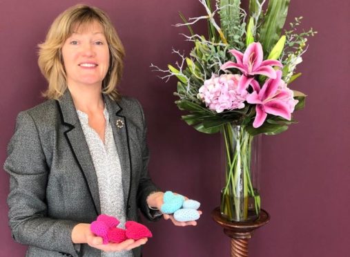 Sheila Matthew, from Crosbie Matthew, with some of the knitted hearts.