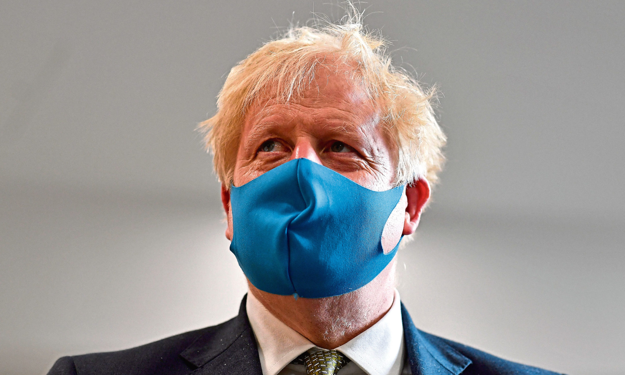 Prime Minister Boris Johnson wearing a face mask.