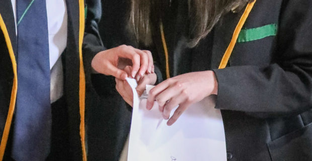 Pupils receiving exam results.