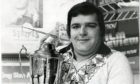 Jocky Wilson with the World Championship trophy in 1982. Image: DC Thomson.
