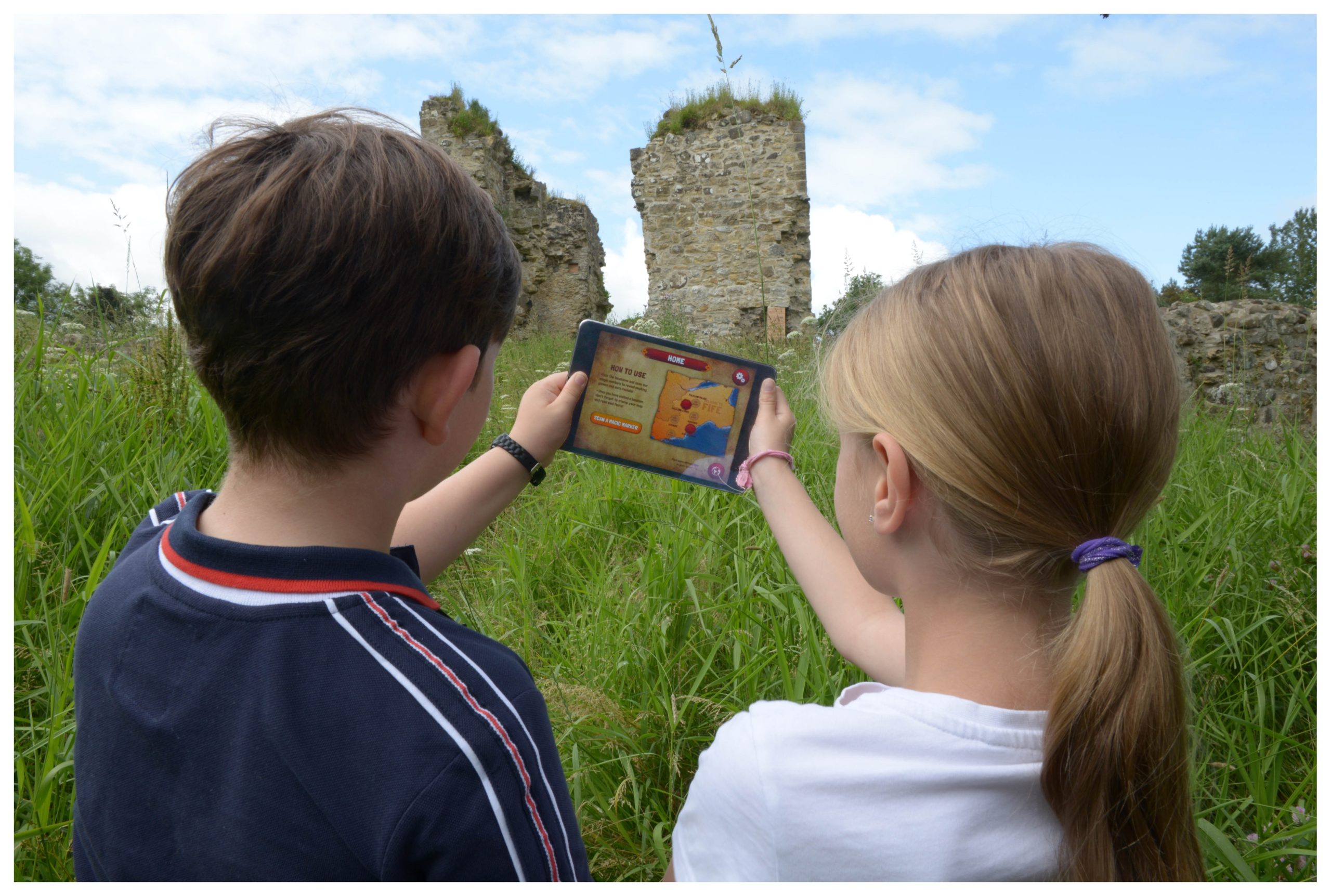 In the Footsteps of Kings, an augmented reality app which allows visitors to trace the steps of historic royal at locations across central Fife. Pictured is Cameron Robertson, 8, and Lily Riach, 10.