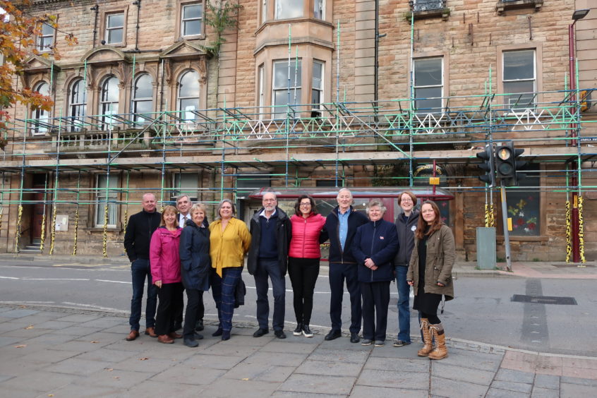 Members of Drummond Arms Regeneration Limited (DARL) outside the hotel in the centre of Crieff.