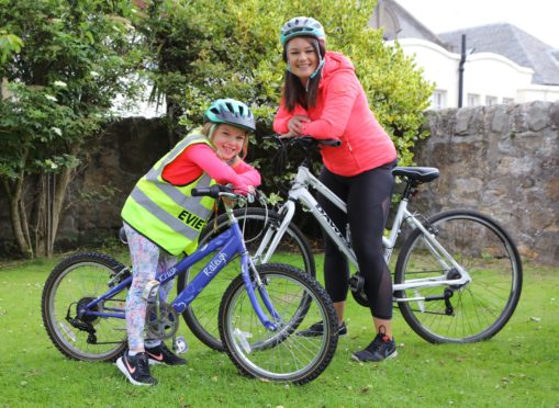 Evie Hughes and her mum Rachel celebrate raising £2,400 for three East Neuk charities.