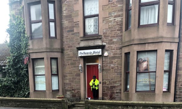 Police at the Dalhousie Hotel in March.