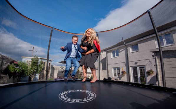 Morgan Brooke-Johnson celebrated on her brother Mason's trampoline.