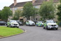 Police attend at Newhouse Road, Perth, on Saturday night.