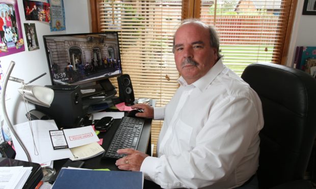 Former Dundee Sheriff Richard Davidson at home.