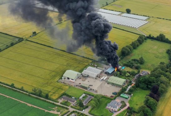 The fire at Rosemount Farm near Blairgowrie, sent plumes of thick black smoke into the sky.