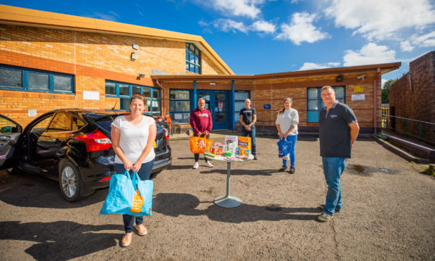 PRI and Ninewells staff nurse Natalie Beattie handed over the donation to Letham4all team members Graham Holden, John Keith, Susan Matson and board member John Rebbeck.