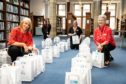 Jillian McFarlane, Sharon Brown, Donna Dewar and Ann McBurnie (Cultural Services Staff) with some of the bags for collection using the new Connect & Collect service at Dunfermline Carnegie Library and Galleries.
