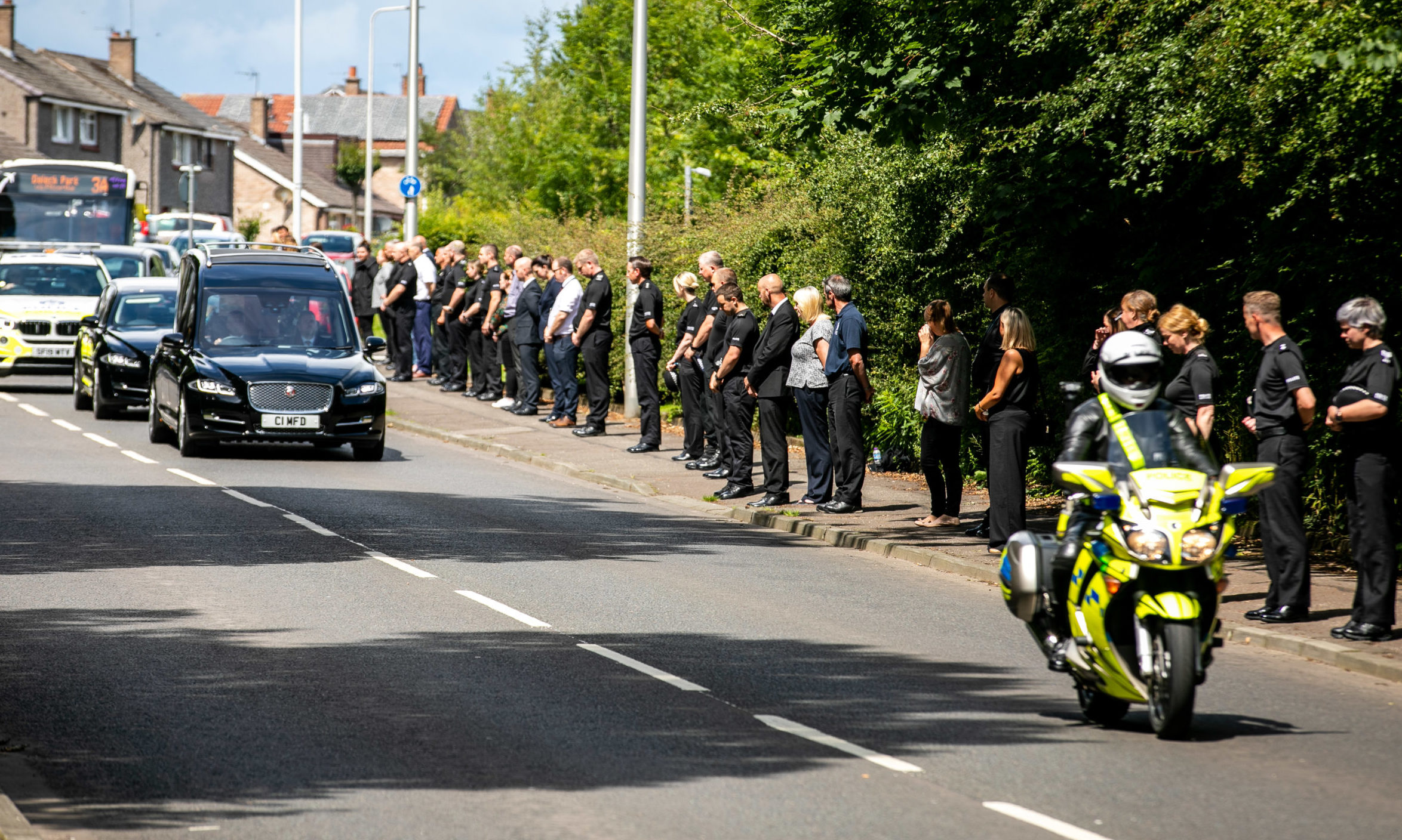 Police line Masterton Road as the funeral procession for Inspector Chris Mutter makes its way to Dunfermline Crematorium.