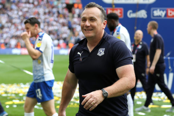 Micky Mellon celebrates play-off success.