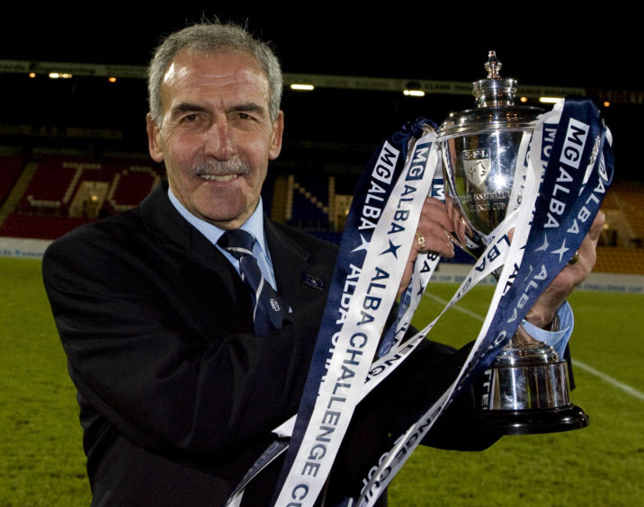 Jocky Scott celebrates winning the Alba Challenge Cup in 2009 as Dundee manager.