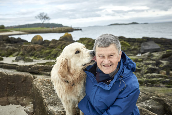 Rob Lester walking his dog,