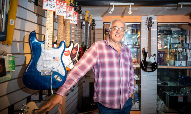 Pete Caban in his Bandwagon Music Shop in Perth
