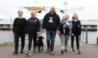 Ahead of their walk on Saturday from the Tay Bridge to the Queensferry Crossing, in aid of Andy's Man Club are from left: April Roberts, Val Lindsay, Ritchie Peter-Tennant, Chez Lesley with baby Lucas-Zak, and Brodie Hamill along with Skip the dog.