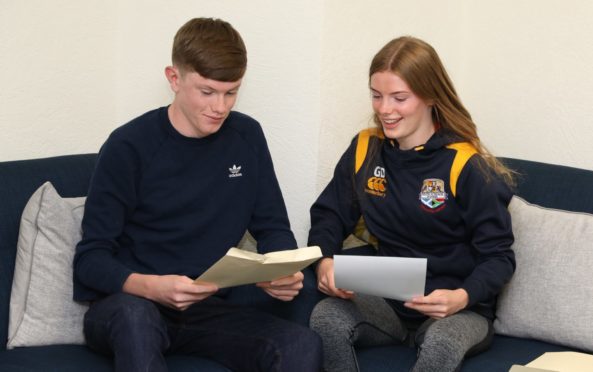 Brother and sister  Alex, 15, and Georgia  Douglas, 17, receive their results at Dundee High School.