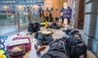 Protestors hold a "die-in" outside the city chamber earlier this year.