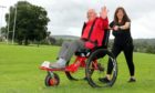 Cycling Without Age CEO Christine Bell takes 83-year-old Norman Ridley for a spin on the Paratreker Trail.