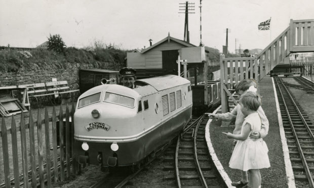 Douglas and Jennifer Payne from Perth enjoyed a close-up of an engine at Kerr's Miniature Railway on June 2 1960.