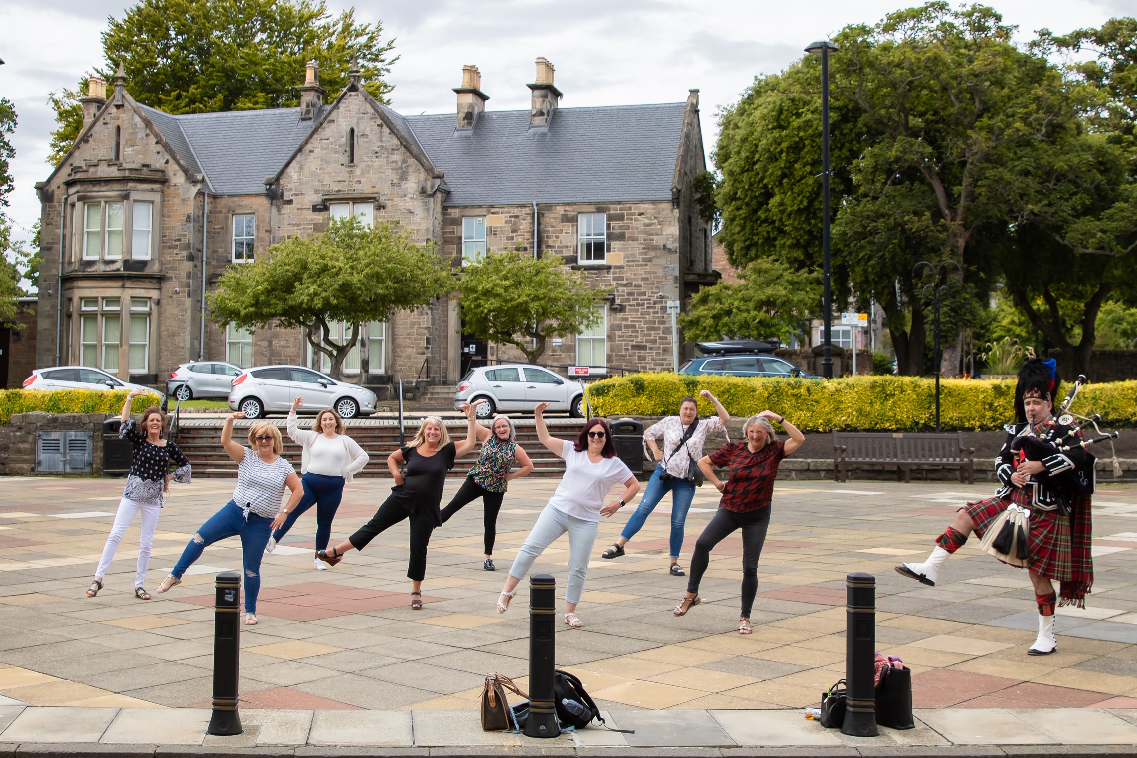 Friends of the bride perform their impromptu dance routine outside Kirkcaldy Town House.